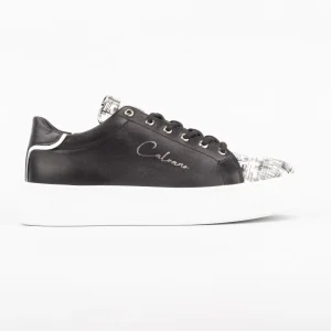 A side view of the Calvano Leather Casual Shoes featuring black leather and monochrome patterns