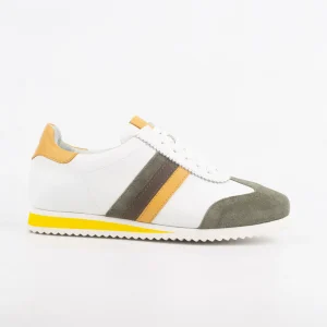 A side view of Calvano leather casual sneakers featuring white leather and olive suede accents