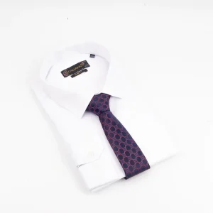 A luxury Calvano patterned necktie in navy and red displayed on a white shirt